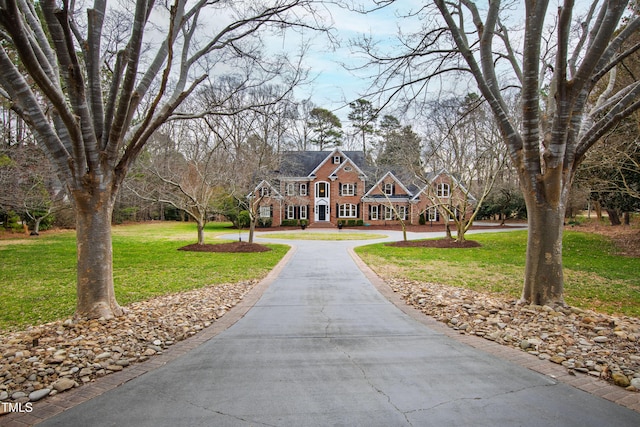 surrounding community featuring a lawn and driveway