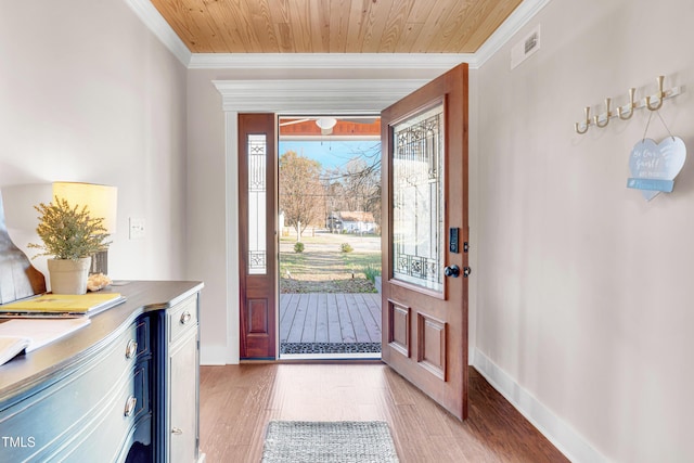 entrance foyer with baseboards, visible vents, ornamental molding, wood ceiling, and light wood-type flooring