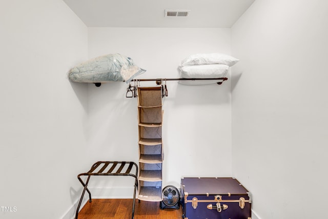 walk in closet with visible vents and wood finished floors