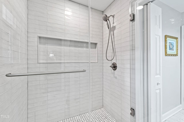 full bath with a shower stall