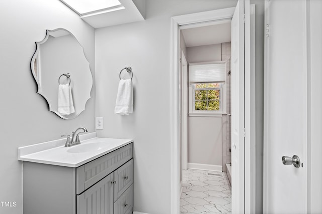 bathroom featuring vanity and baseboards