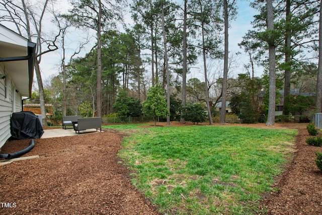 view of yard featuring a patio area and fence