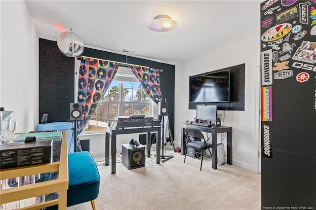 carpeted home office with visible vents and baseboards