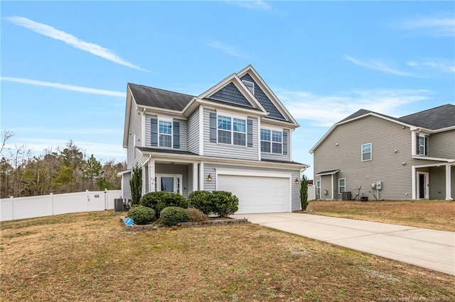 view of front facade featuring a front lawn, fence, cooling unit, concrete driveway, and a garage