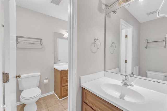 bathroom featuring tile patterned flooring, visible vents, toilet, and vanity