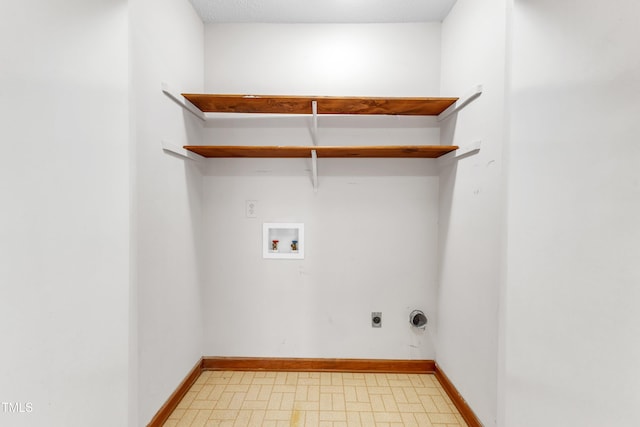 clothes washing area featuring light floors, baseboards, hookup for an electric dryer, laundry area, and washer hookup