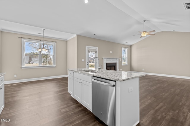 kitchen featuring a ceiling fan, a sink, stainless steel dishwasher, dark wood-style floors, and a fireplace