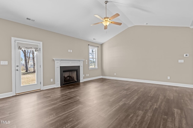 unfurnished living room with a ceiling fan, baseboards, a fireplace, dark wood-style flooring, and vaulted ceiling