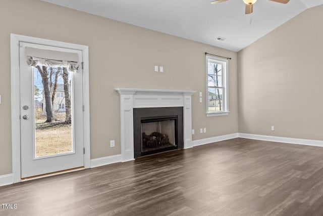 unfurnished living room with baseboards, lofted ceiling, ceiling fan, and wood finished floors