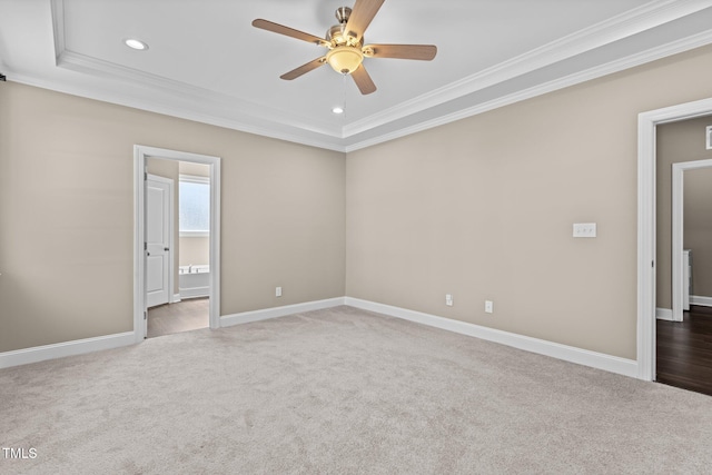 empty room featuring ornamental molding, carpet, and ceiling fan