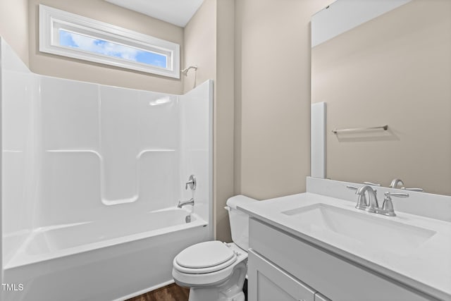 bathroom with shower / tub combination, toilet, vanity, and wood finished floors