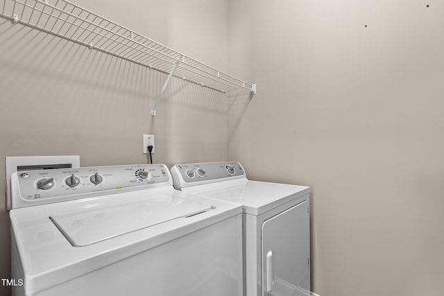 laundry room featuring laundry area and washing machine and dryer