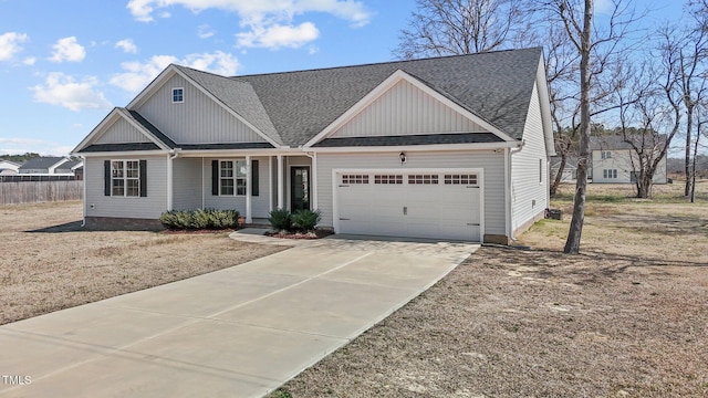 view of front of home with a porch, fence, concrete driveway, a shingled roof, and a garage