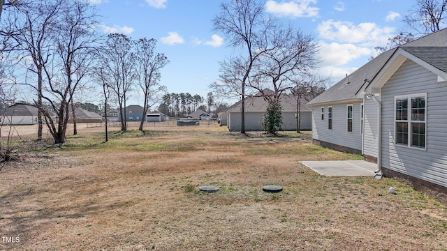 view of yard featuring a patio area and fence