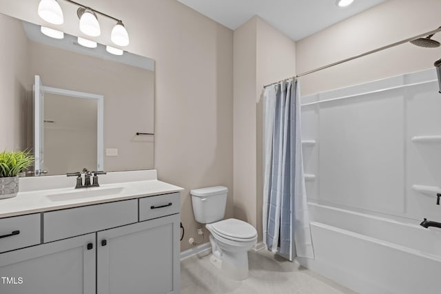 full bath featuring baseboards, toilet, vanity, and shower / bath combination with curtain