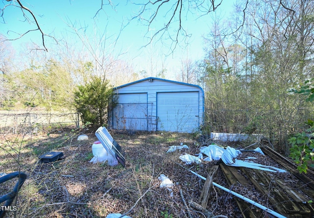 exterior space with an outbuilding and fence