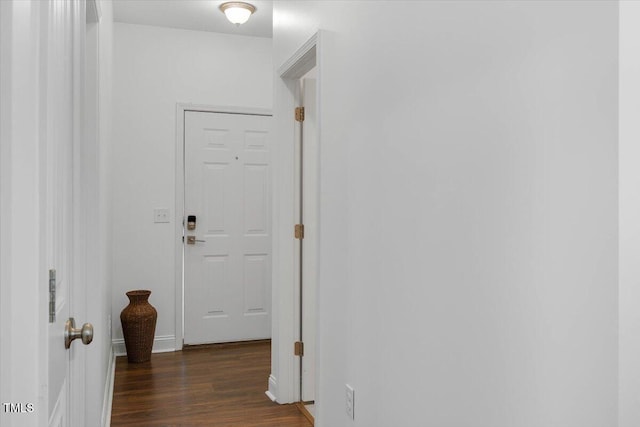 corridor featuring wood finished floors