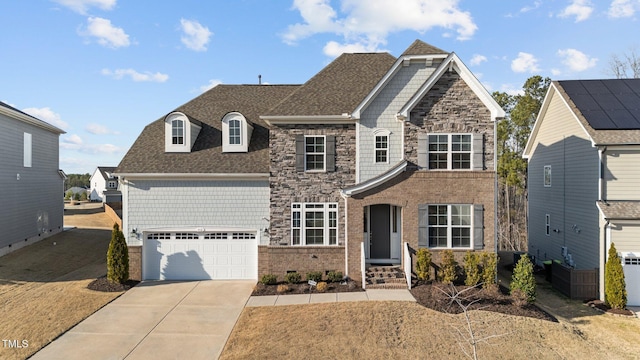 view of front of house featuring a garage, stone siding, roof with shingles, and concrete driveway