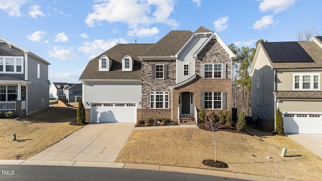 view of front of home with brick siding, a shingled roof, a garage, stone siding, and driveway