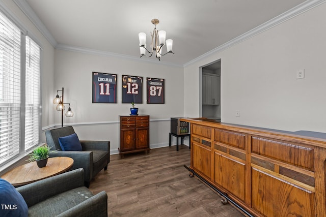 sitting room with plenty of natural light, an inviting chandelier, dark wood-style floors, and crown molding