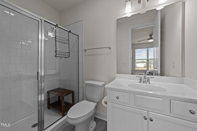 ensuite bathroom with ensuite bathroom, toilet, a stall shower, and vanity