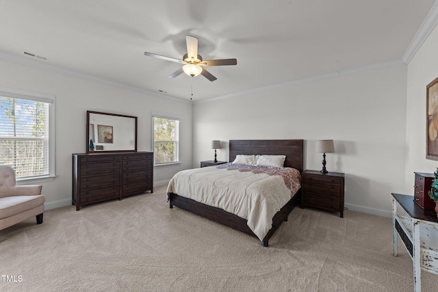 bedroom featuring visible vents, crown molding, baseboards, light colored carpet, and ceiling fan