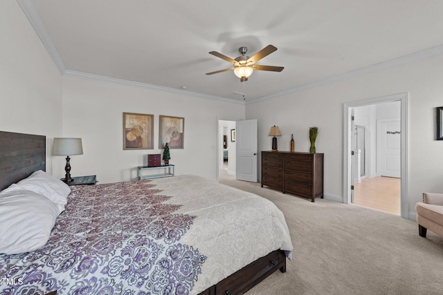 bedroom featuring baseboards, carpet, ornamental molding, and a ceiling fan