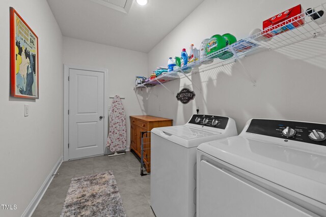 laundry room with laundry area, separate washer and dryer, and baseboards