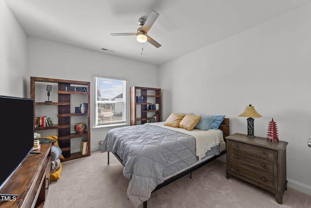 bedroom with visible vents, carpet floors, baseboards, and ceiling fan