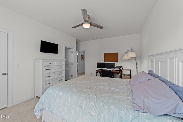 bedroom featuring baseboards, light carpet, and a ceiling fan