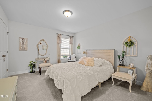 bedroom featuring carpet flooring and baseboards