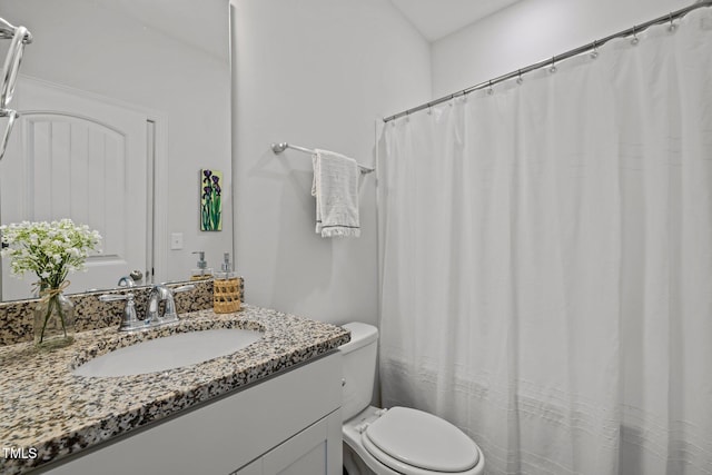 bathroom with toilet and vanity