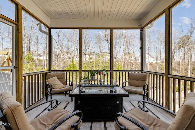 sunroom / solarium with wood ceiling