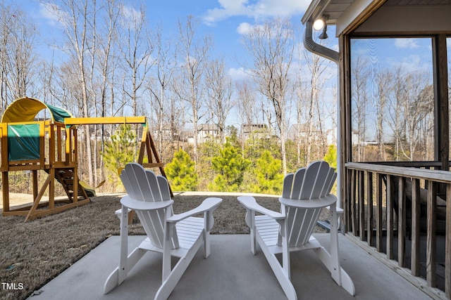 view of patio featuring a playground