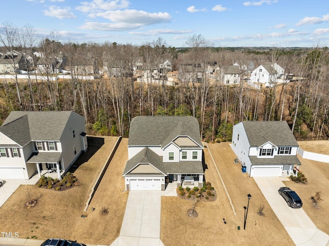 birds eye view of property with a residential view