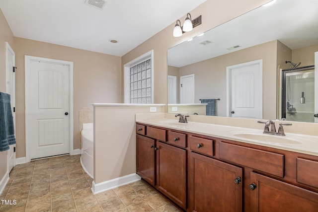 bathroom with a sink, visible vents, and a stall shower