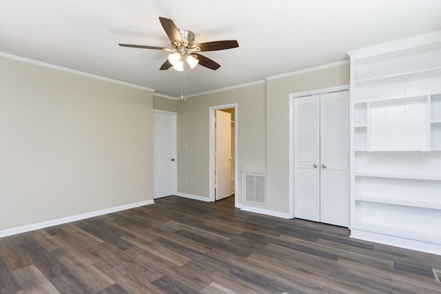 unfurnished bedroom with dark wood-type flooring, baseboards, visible vents, and ornamental molding