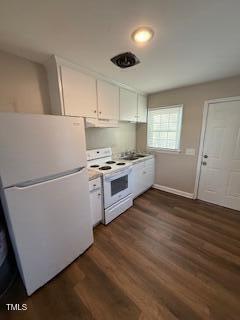 kitchen featuring dark wood finished floors, white appliances, baseboards, and white cabinetry