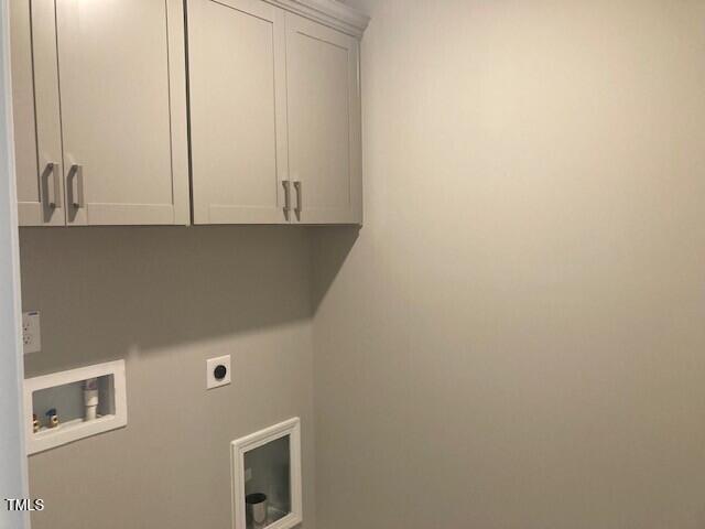 laundry room with hookup for a washing machine, cabinet space, and electric dryer hookup