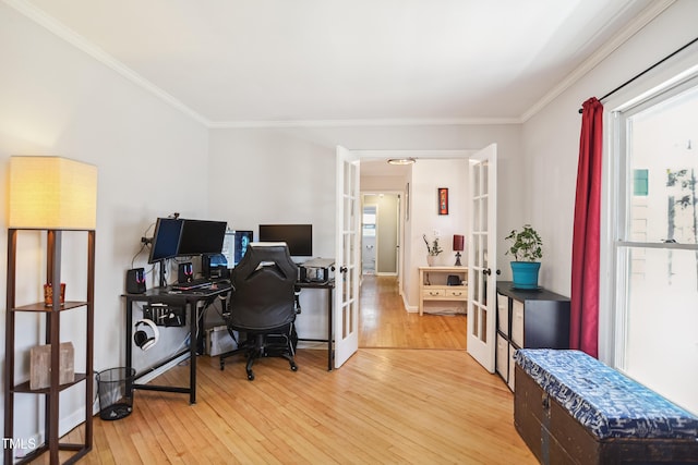 office featuring light wood-style flooring, french doors, and ornamental molding