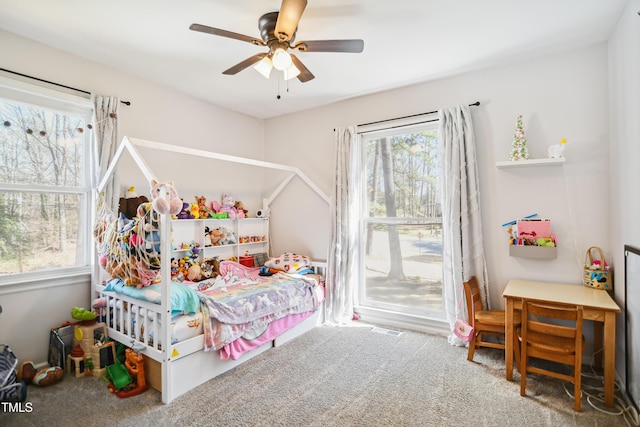 carpeted bedroom featuring ceiling fan