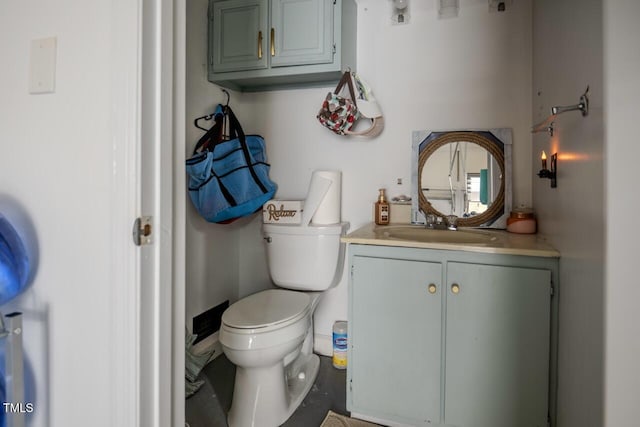 bathroom with toilet and vanity