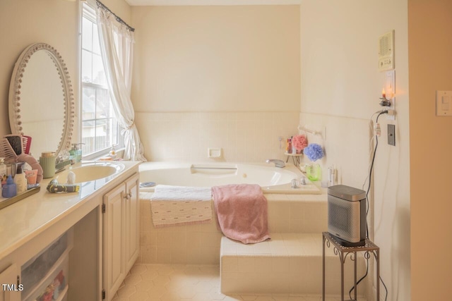 bathroom featuring vanity and a garden tub