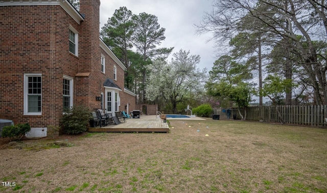 view of yard featuring a fenced backyard and a deck