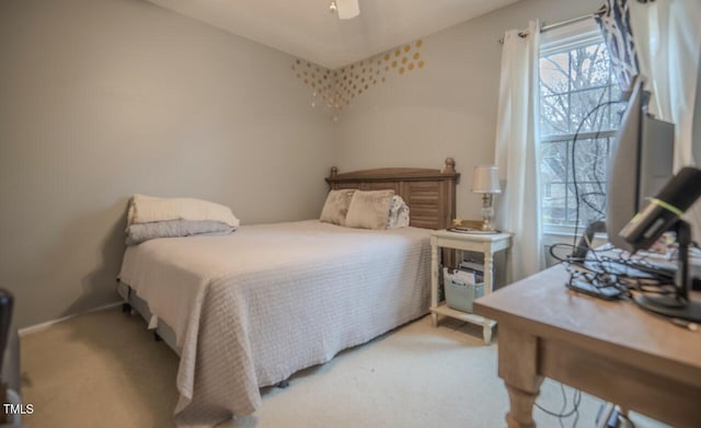 carpeted bedroom featuring a ceiling fan