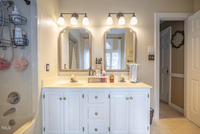 bathroom with a sink, double vanity, and shower / bath combination with curtain