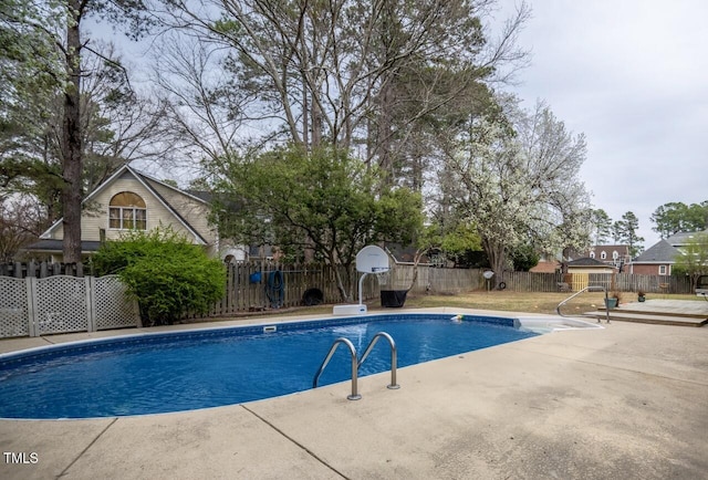 view of swimming pool with a fenced in pool, a patio, and fence