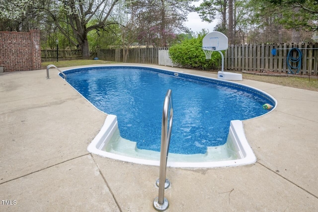 view of pool with a fenced in pool, a patio, and a fenced backyard