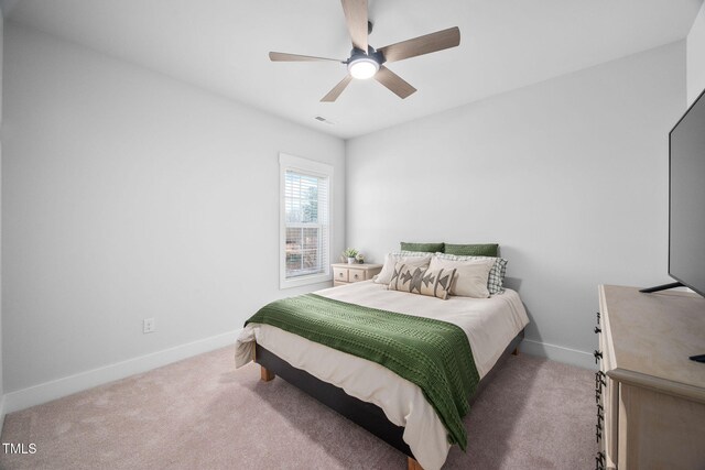 bedroom featuring visible vents, carpet floors, and baseboards