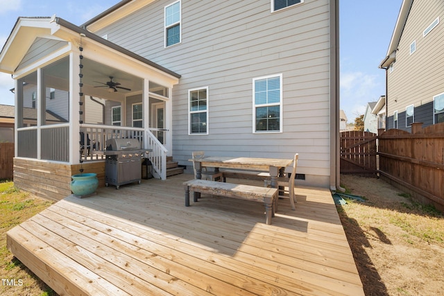 wooden terrace featuring outdoor dining space, a fenced backyard, a sunroom, ceiling fan, and a grill